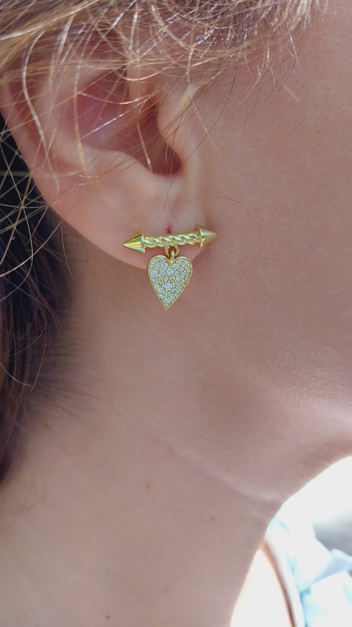 These exquisite earrings, inspired by the arrows of the goddess of love, encapsulate the essence of romance and passion. Each earring is delicately designed to evoke the enchanting allure of love’s embrace, making them the perfect accessory for a woman in love. Crafted with intricate details, they shimmer gently, catching the light with every movement.
