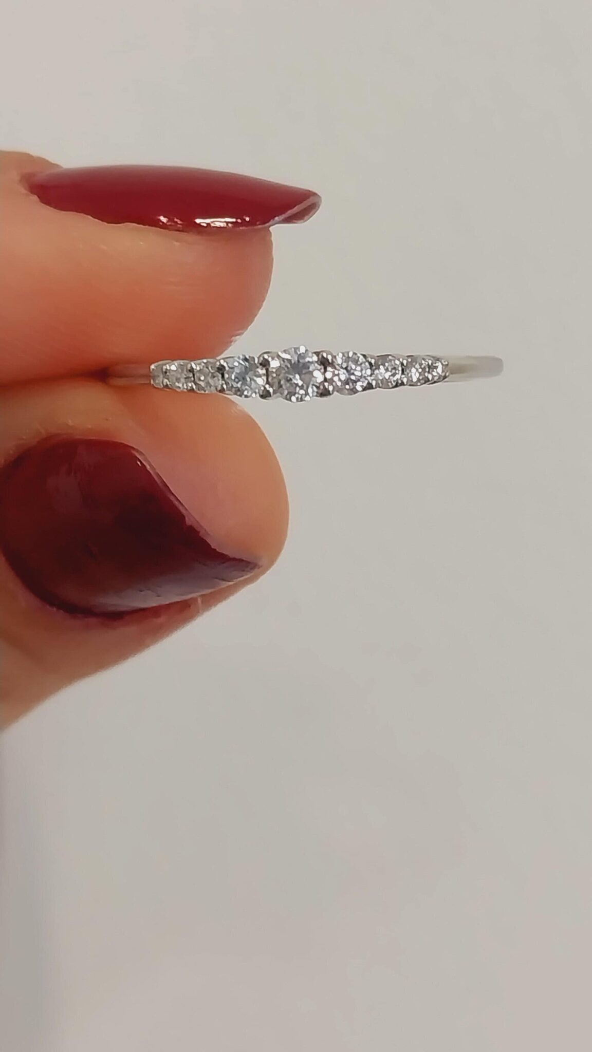 Adorning the band are shimmering, ethically sourced diamonds that sparkle beautifully with every movement. Their brilliant cut reflects light in a way that captures the essence of your promise, drawing the eye and capturing hearts. The ring’s design elegantly balances simplicity and luxury, making it an ideal choice for a promise ring, anniversary gift, or a statement piece for yourself.
