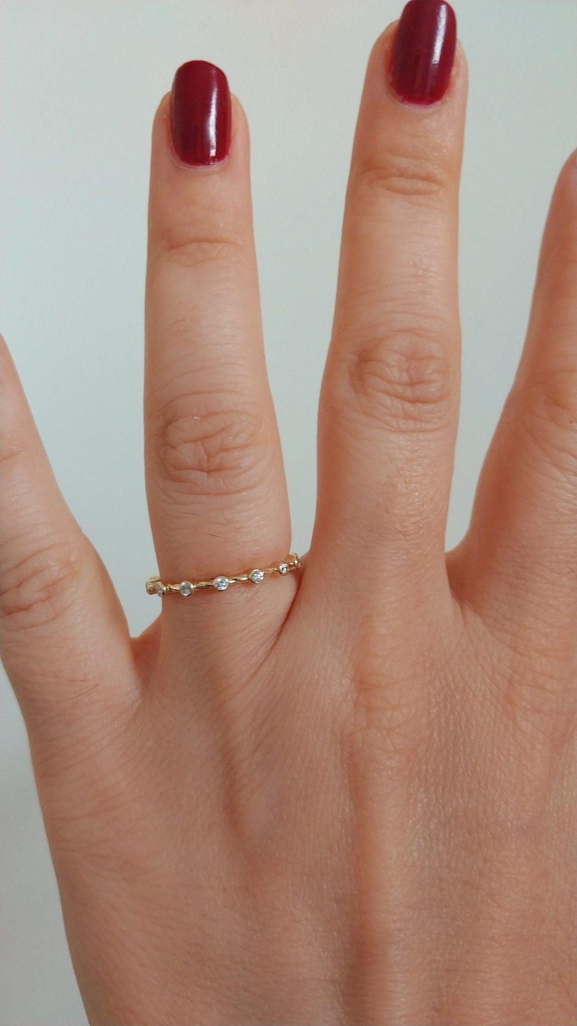 Designed for the modern bride, this band strikes the perfect balance between minimalism and luxury, making it an ideal complement to your engagement ring or a standalone statement of love. The subtle brilliance of the diamonds brings an enchanting touch, emphasizing the timeless nature of your commitment.