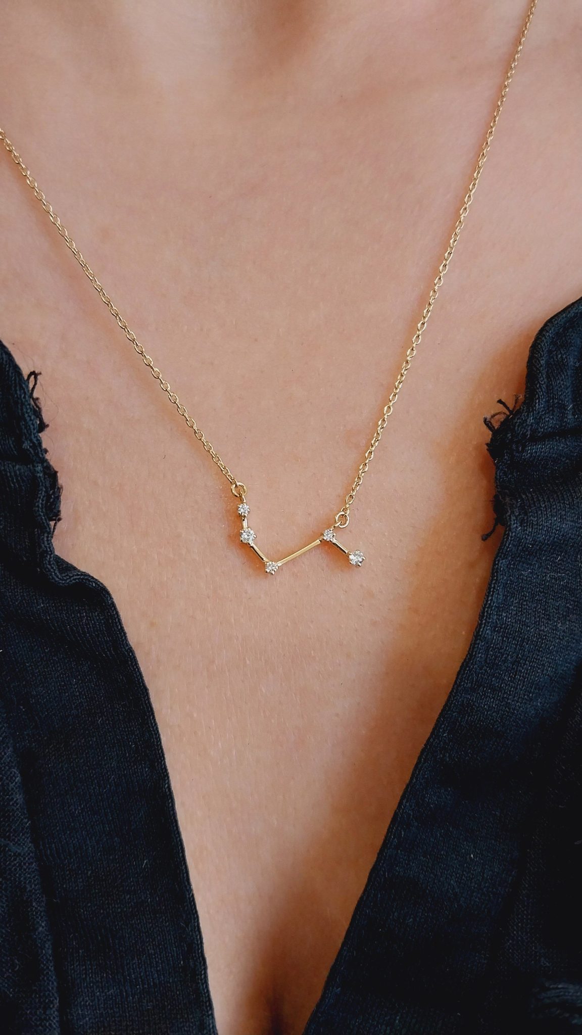 The pendant is expertly designed to represent the iconic scorpion symbol and is intricately crafted to create a stunning work of art that sparkles with every movement. The pendant dangles elegantly from a thin chain, adding an elegant yet bold statement to any outfit.