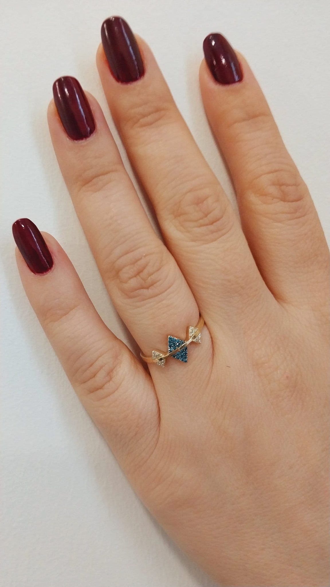 Meet our elegant ring, a masterpiece that skillfully combines elegance with a touch of indulgence. Crafted from a range of striking marquise-shaped pieces, this piece displays a harmonious blend of sophistication and whimsy. Just as baklava delights the senses with its layers of flavor and texture, our ring fascinates with its intricate design and sparkling presence. Each marquise stone reflects light like golden layers of dough, evoking the sweetness and richness found in every bite of this beloved treat.